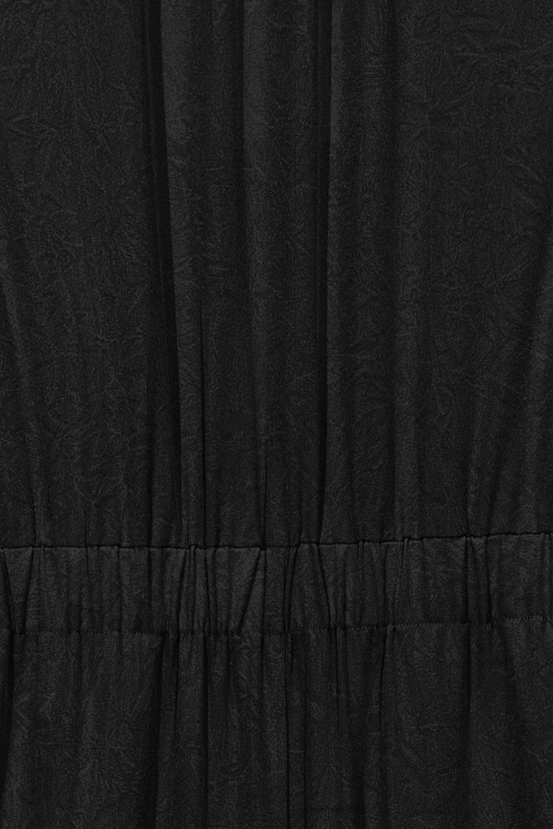 Women's High Neck sleevless Jumpsuit with a marble texture effect.