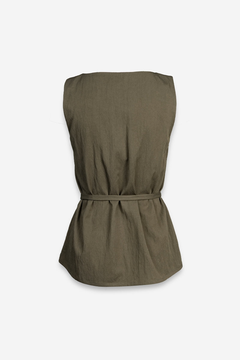 Green sleeveless top with a belt on a white background