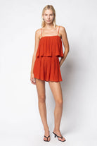 Woman wearing a red dress against a white background