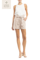 Woman wearing a white sleeveless top and beige striped shorts on a white background with 'Linen Blend' branding.