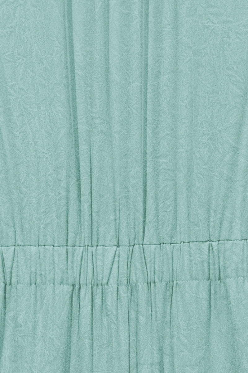 Women's High Neck sleevless Jumpsuit with a marble texture effect.